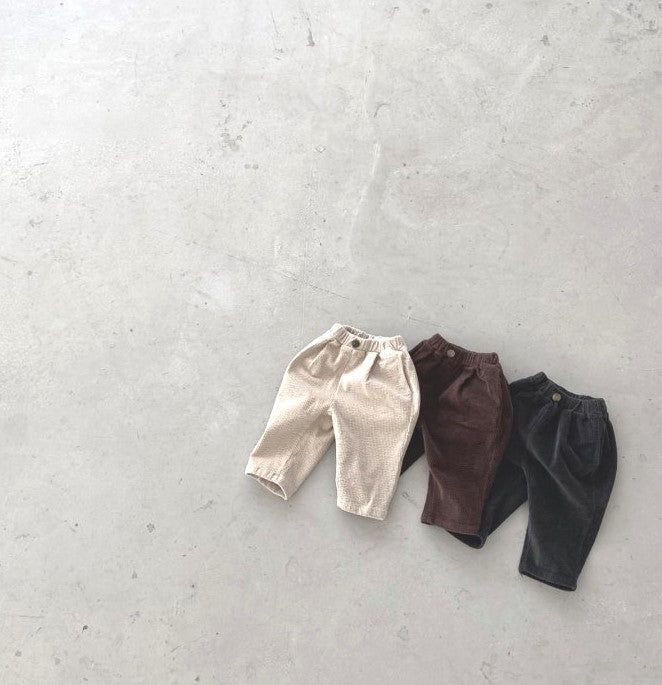 Stylish corduroy ribbed toddler pants in neutral tones.